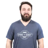Man wearing a blue Stroke My Scruff tee